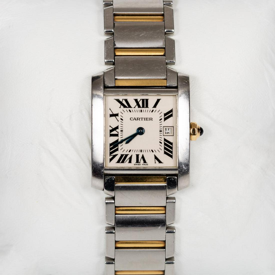 CARTIER TANK FRANCAISE, 18K YG & STAINLESS WATCH: Cartier (French, founded 1847). An 18k yellow gold and stainless steel "Francaise" tank model wrist watch with automatic movement, Roman numeral dial, and date set. Marked to verso "Cartier, Water Res