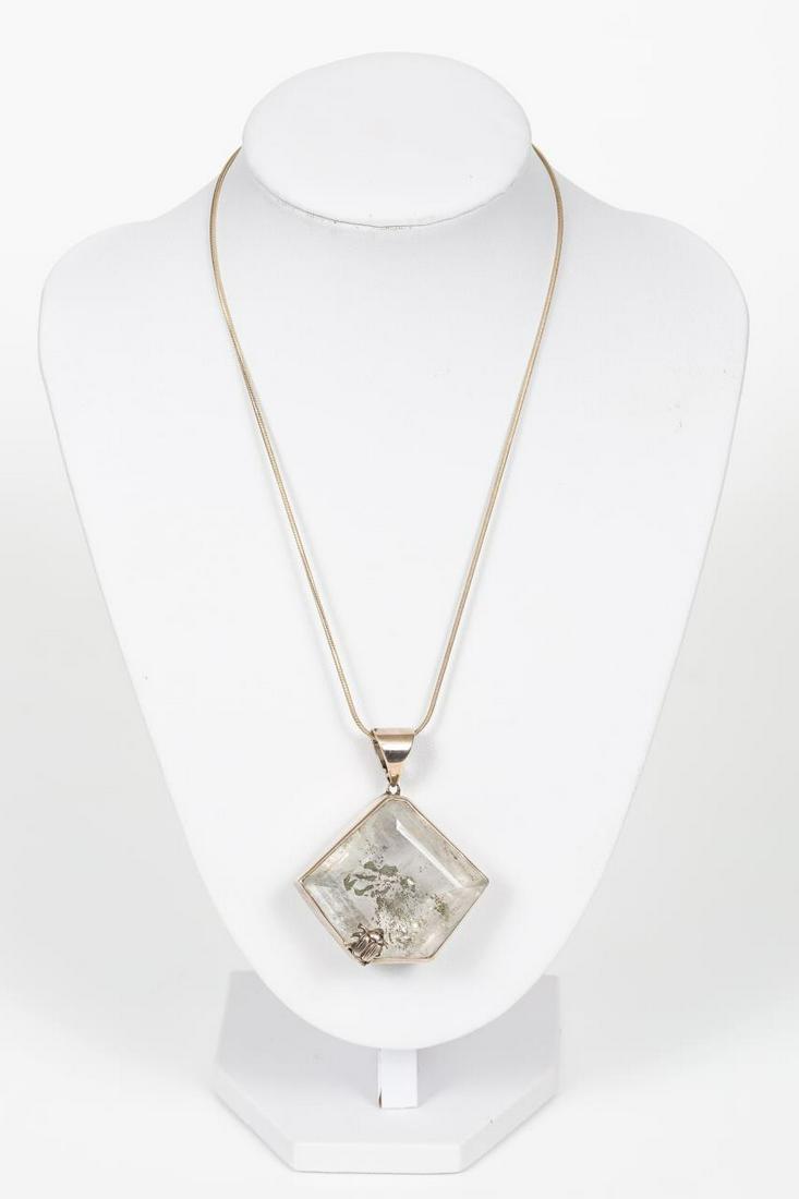STEPHEN DWECK STERLING & QUARTZ BEETLE NECKLACE: A Stephen Dweck (American) Sterling silver and quartz pendant having metallic flakes and beetle accent on sterling snake chain. Signed, to interior of pendant, with copyright, "One of a Kind", 15572 1