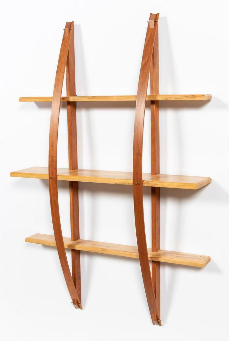 STUDIO FURNITURE TWO TONED WOOD HANGING SHELF: American, 2004. Modern Studio Furniture style hanging shelf in two tone wood colors, likely fruit and cherry wood. Pencil signed and dated to back.Approx. h. 52.25", w. 35", d. 9.5".