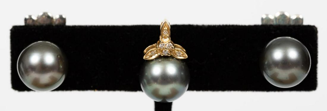 3 PC, TAHITIAN BLACK PEARL PENDANT & EARRING SET: A jewelry set consisting of a pair of Tahitian black pearl earrings of 10.68mm set with 14k posts and a matching 14K pendant with a 10.60mm Tahitian black pearl and six accent diamonds affixed to the 