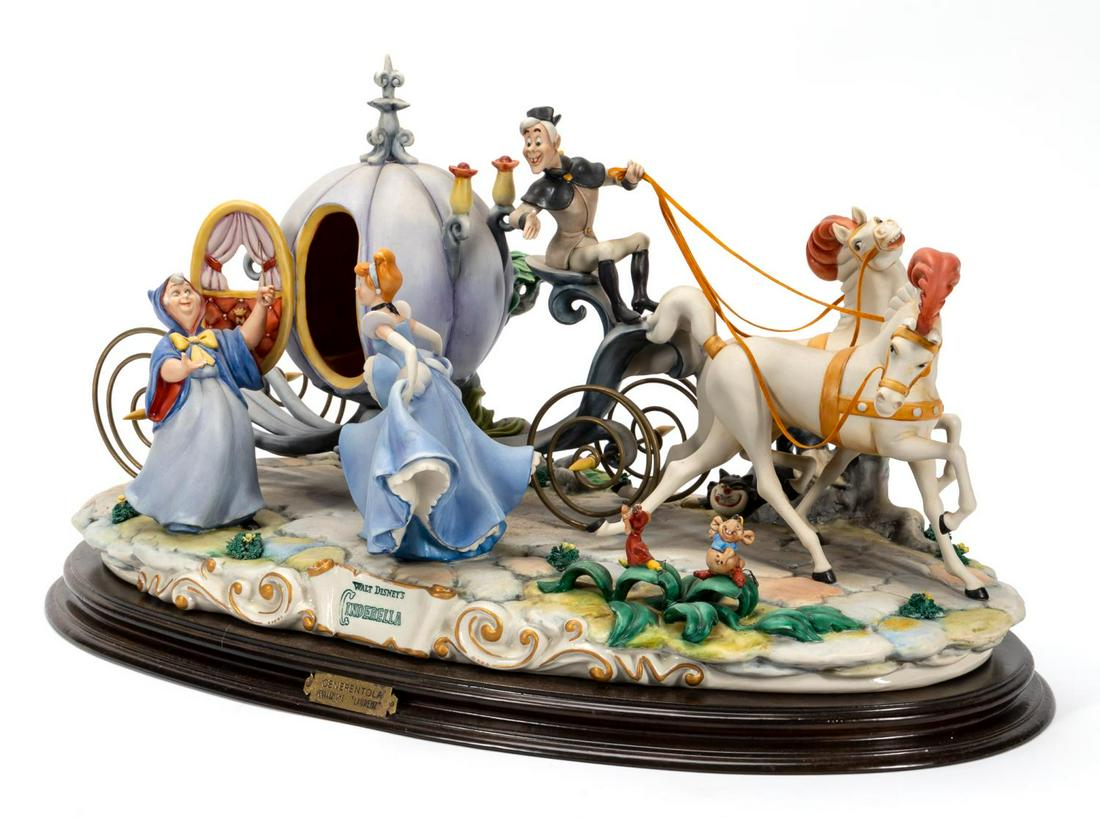 CAPODIMONTE, CINDERELLA GROUP, ENZO ARZENTON: Enzo Arzenton (Italian, 20th c.) for Capodimonte "Walt Disney's Cinderella" porcelain figural group on wooden base, edition of 2500. Maker's mark to three areas.Approx. h. 13.5" w 23.5" d. 10":