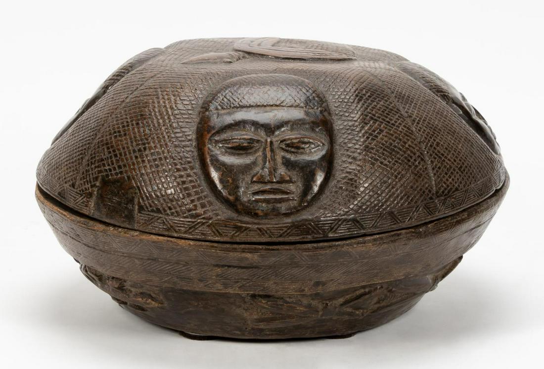 AFRICAN YORUBA CARVED WOOD LIDDED DIVINATION BOWL: African, 20th century. Yoruba carved wooden divination bowl having sectioned interior. Apparently unmarked.Approx. h. 10", diam. 17.5".