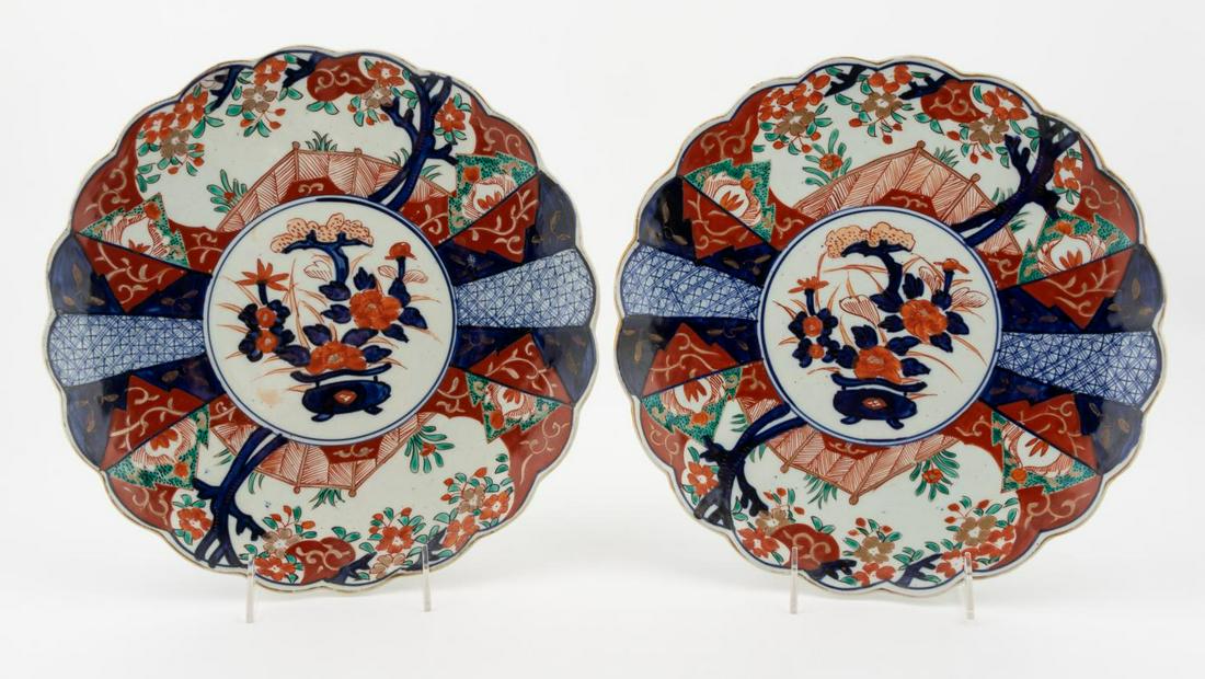 PAIR, JAPANESE PORCELAIN IMARI SCALLOPED CHARGERS: Japanese. Pair of antique Imari chargers having center tree pattern and scalloped rim. Apparently unmarked.Approx. diam. 12.25".