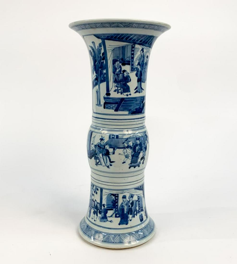 CHINESE QING STYLE BLUE AND WHITE GU FIGURAL VASE: Chinese. Qing style blue and white porcelain gu or beaker vase having reserves decorated with figures in a landscape. Six-character Kangxi type mark to the underside. Approx. h. 18.25", dia. 8.75" (mo