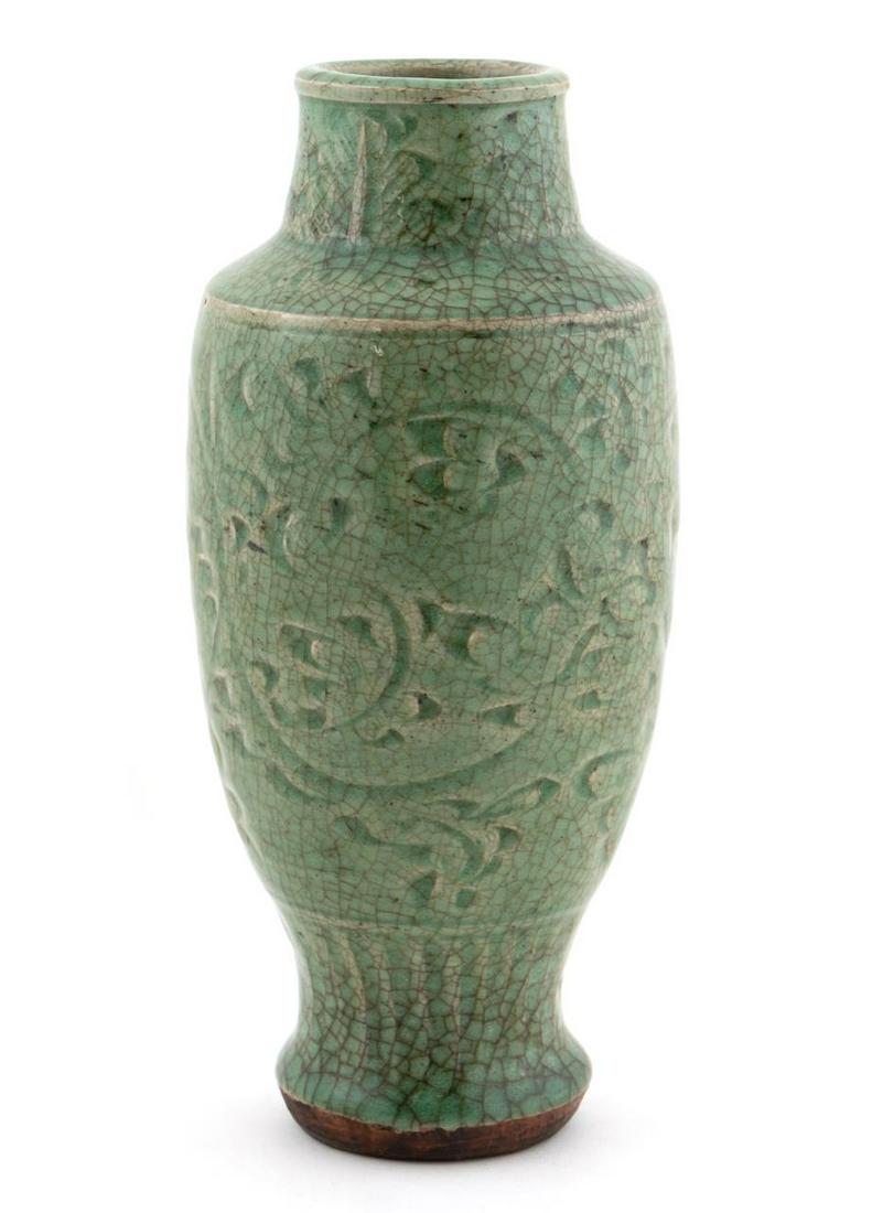CHINESE MING DYNASTY CELADON VASE: Chinese. Ming dynasty Longquan celadon glazed ceramic vase with light floral decoration. Apparently unmarked. Approx. h. 9.75".