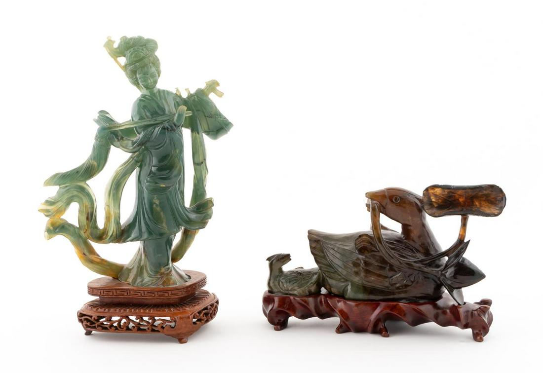 TWO CARVED JADE PIECES ON STANDS: Chinese. Group of two carved jade figurines on stands comprising of one green Quanyin and one green brown duck. Apparently unmarked.Approx. h. 8.5" (Guanyin on stand), h. 4.375", w. 6.75" (duck on sta