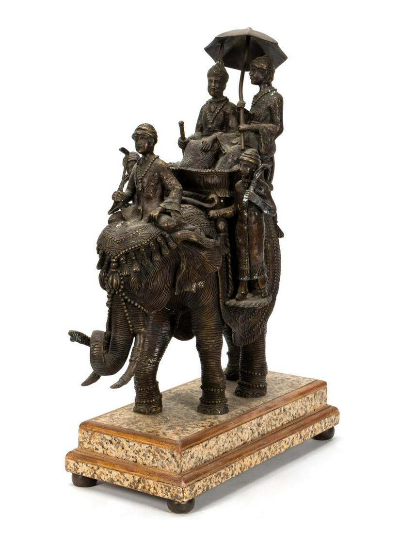 CAST BRONZE SCULPTURE OF FIGURES ON ELEPHANT: Republic of India, 20th century. Cast bronze statue of an elephant with two figures in a houdah, with driver and attendants, gold/brown patina, mounted on a marble clad stepped plinth base with ball f