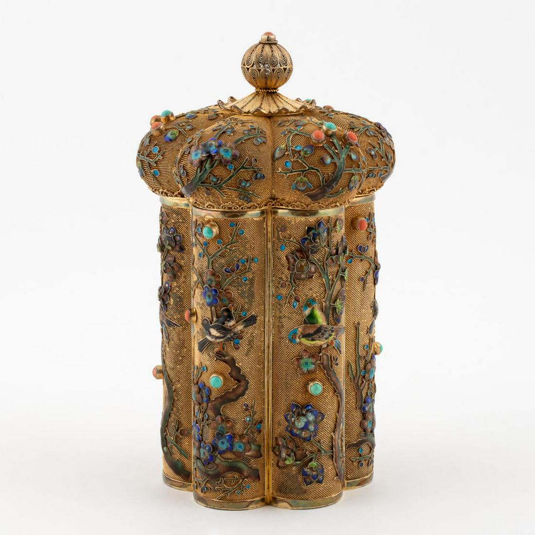 CHINESE ENAMELED & SILVER LIDDED TEA CADDY: Chinese, mid 20th century. Silver-gilt filigree lidded box with floral and bird enamel motif, and applied turquoise and coral cabochon stone accents. Marked "Silver" to underside. Approx. h. 7".