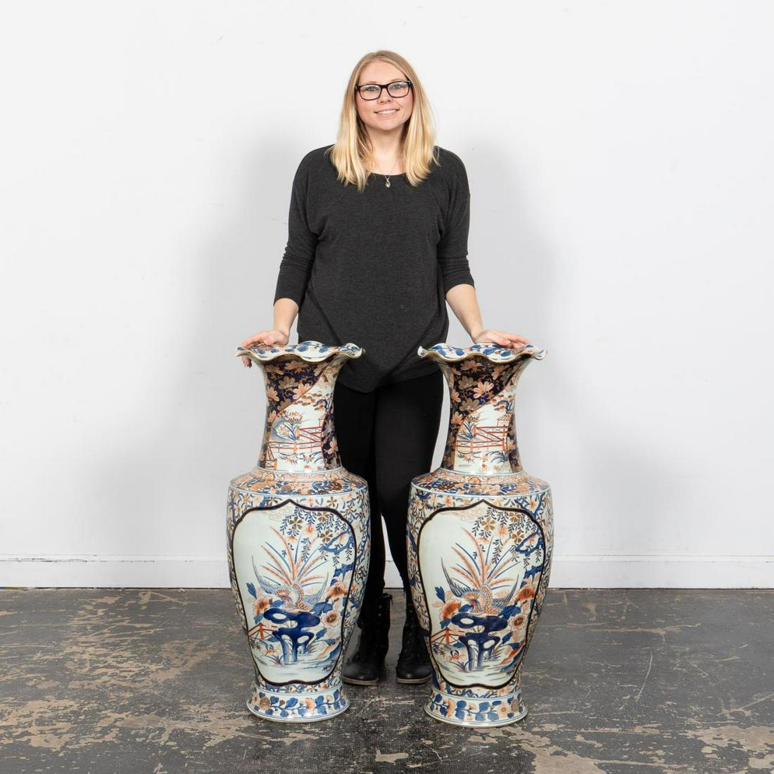 MONUMENTAL PAIR OF CHINESE IMARI FLOOR VASES: Chinese. A monumental pair of Imari floor vases with two figural bird viewing windows to the main body with blue, red and gilt floral motif accents to each. Apparently unmarked.Approx: h. 37", w. 14".
