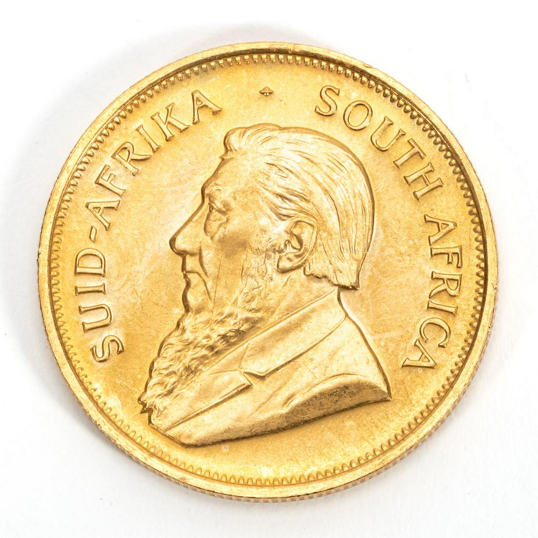 ONE SOUTH AFRICAN KRUGERRAND, 1975: One South Africa 1975 gold Krugerrand coin. 916.70 fineness.Approx. total weight 1.08 ozt. Payment methods for this lot include wire transfer, certified check, or cash. Credit card payment will not be