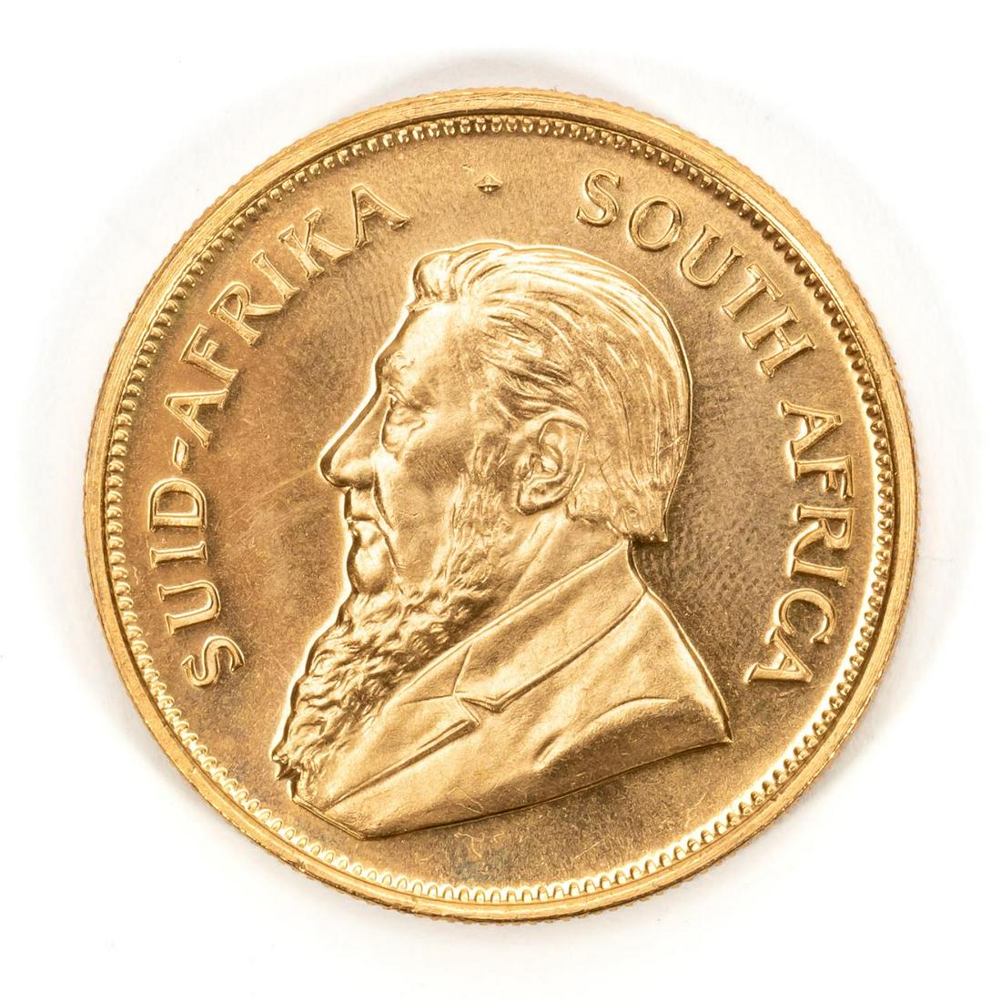 ONE SOUTH AFRICAN KRUGERRAND, 1975: One South Africa 1975 gold Krugerrand coin. 916.70 fineness.Approx. total weight 1.08 ozt. Payment methods for this lot include wire transfer, certified check, or cash. Credit card payment will not be