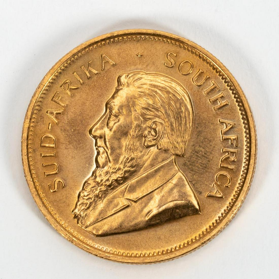 ONE SOUTH AFRICAN KRUGERRAND, 1975: One South Africa 1975 gold Krugerrand coin. 916.70 fineness.Approx. total weight 1.08 ozt. Payment methods for this lot include wire transfer, certified check, or cash. Credit card payment will not be