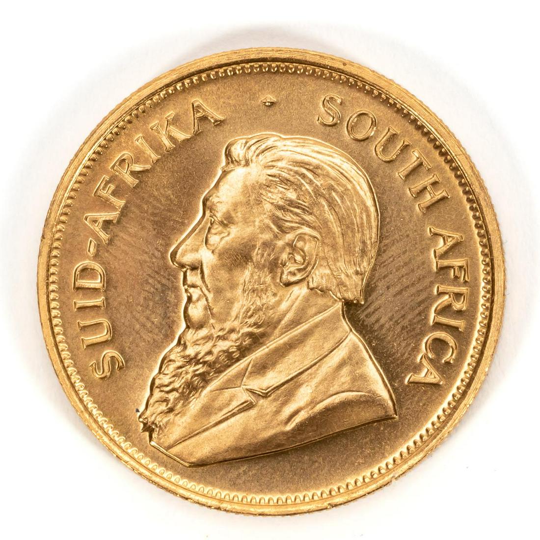 ONE SOUTH AFRICAN KRUGERRAND, 1975: One South Africa 1975 gold Krugerrand coin. 916.70 fineness.Approx. total weight 1.08 ozt. Payment methods for this lot include wire transfer, certified check, or cash. Credit card payment will not be