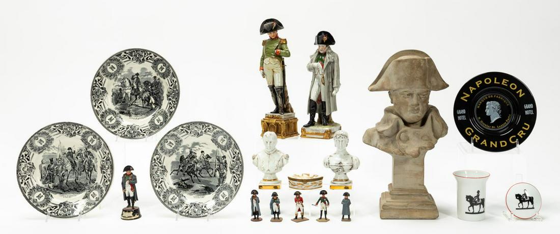 18 PIECES, GROUP OF NAPOLEON FIGURES AND IMAGERY: Collection of eighteen Napoleon related items comprising composite bust, two standing porcelain figures, two busts of Napoleon and Josephine marked Limoges, matching cup and covered box, small box, fi