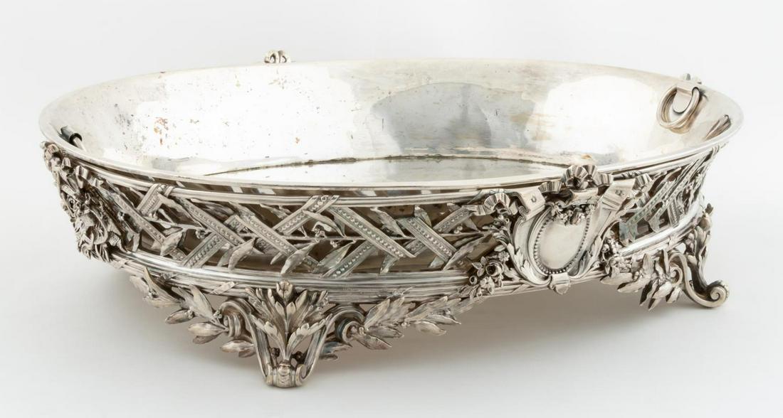 CHRISTOFLE, FRENCH ORNATE SILVERPLATE CENTERPIECE: Christofle (French, founded 1830), likely circa 1940. Heavily pierced silverplate centerpiece having an ornate cartouches, hand chased floral basket motifs and foliate decorations to the main body and