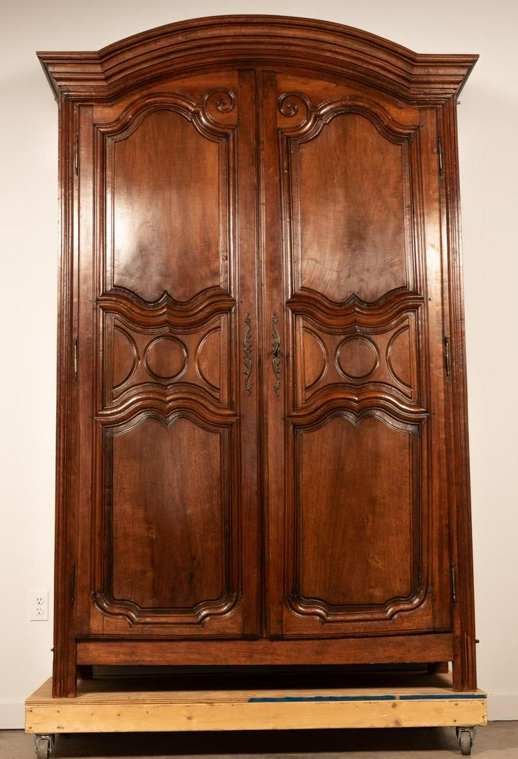19TH C. FRENCH LOUIS XV STYLE WALNUT ARMOIRE: French, 19th century. A walnut & fruitwood armoire in Louis XV style of typical form having an arched cornice over 2 doors with shaped and molding framed panels, straight legs. Signed to lower left fr