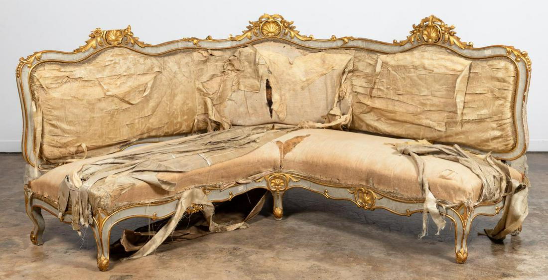 LOUIS XV GILTWOOD CURVED SOFA: Continental, likely Italian. Antique Louis XV style curved corner sofa with gilt shell decoration and natural fiber stuffing. Apparently unmarked.Approx. h. 48.5, w. 78.5", d. 27.375".