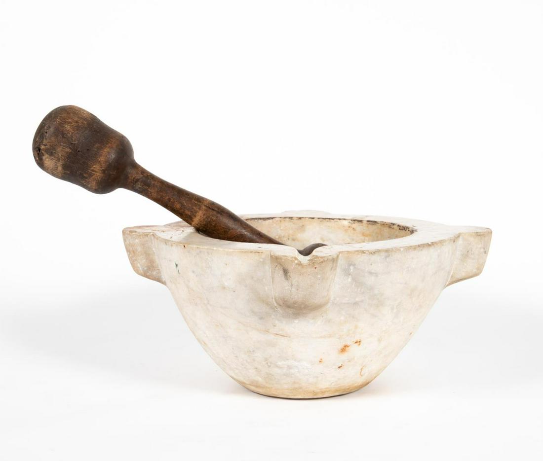 LATE 19TH C. MONUMENTAL MARBLE MORTAR & PESTLE: French, late 19th century or earlier. Antique monumental marble mortar and double-end wood pestle. Apparently unmarked.Approx. h. 8", w. 18" (bowl), l. 18.5" (pestle).