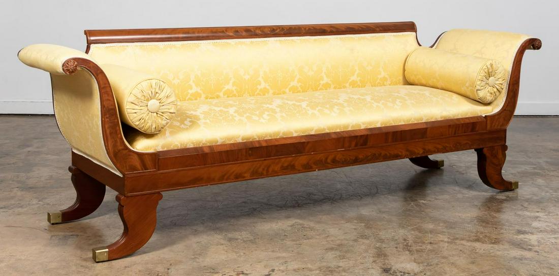19TH C. AMERICAN FEDERAL MAHOGANY SOFA: American, early 19th century. Mahogany framed Federal style sofa with flame mahogany veneers, rolled out arms having rosette terminals, and yellow damask fabric upholstery. Apparently unmarked.Approx.