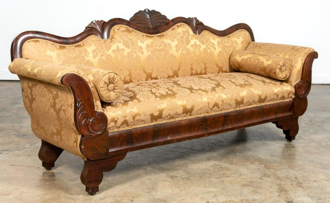 19TH C. MAHOGANY FRAME VICTORIAN SOFA: American, mid-19th century. Victorian style sofa with flame mahogany veneered frame having flared arms, fan carved crest, and scroll feet. Copper colored damask fabric.Approx. h. 35.625" , l. 80.5", d