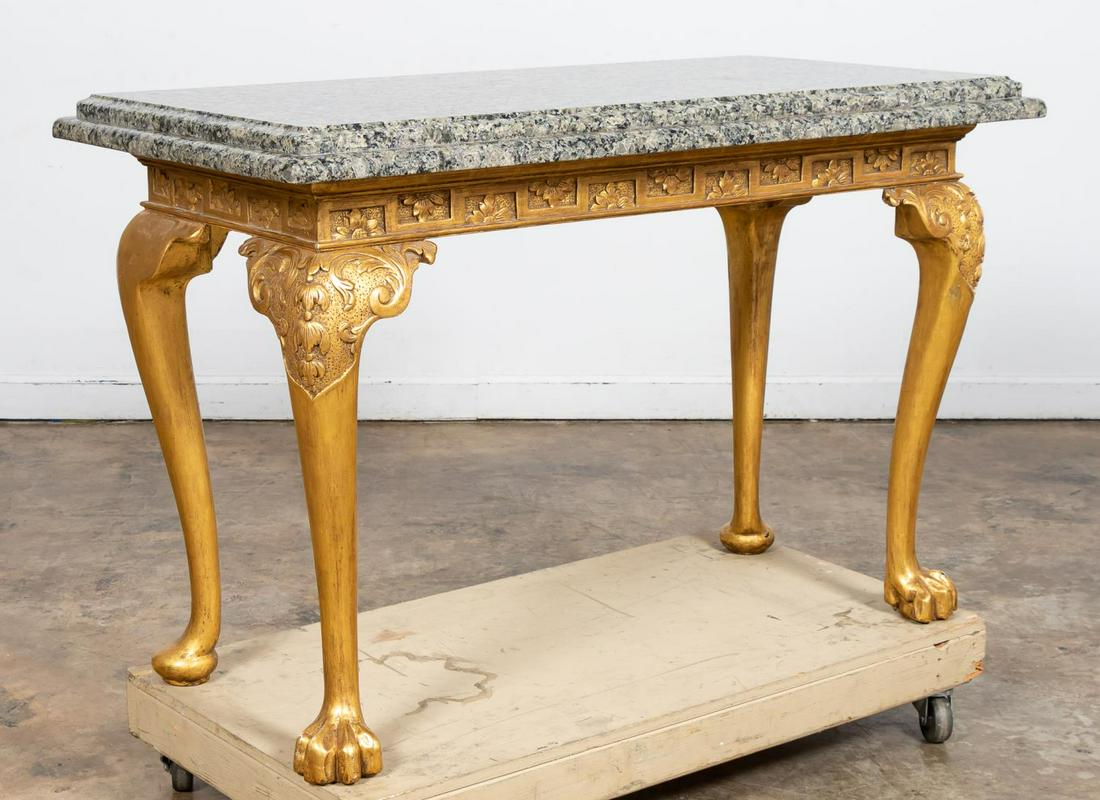 GEORGE II STYLE GRANITE TOP GILT WOOD CONSOLE: American, early 20th century. George II style console or side table with gilt finish, flower carved frieze, cabriole legs with paw front feet and pad rear feet. Late gray & black custom granite top (o