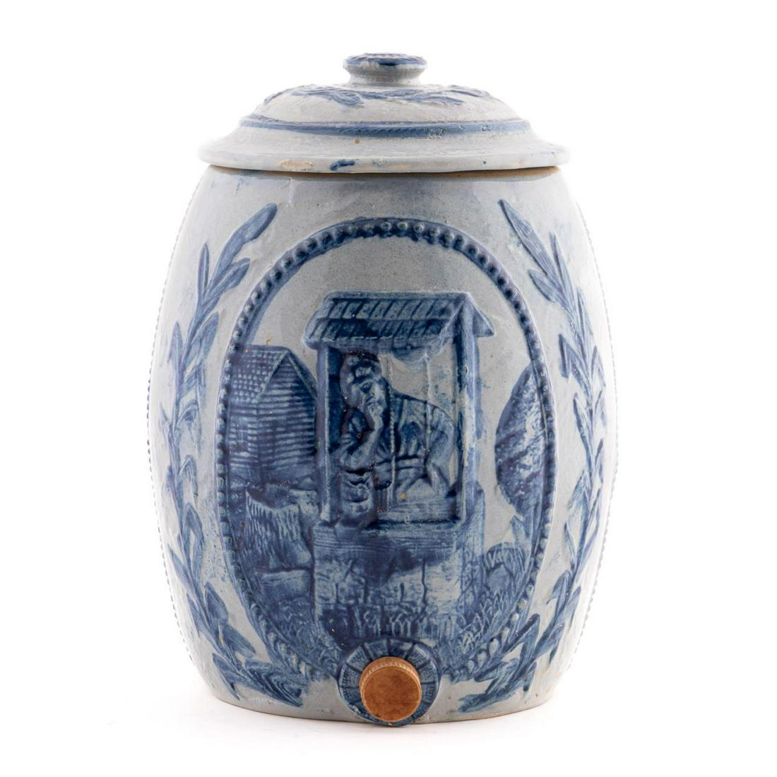 ROBINSON CLAY CO. REBECCA AT THE WELL WATER COOLER: Robinson Clay Company (American, early 20th century). A stoneware water color model named "Rebecca at the Well". Marked to underside "Robinson Clay Co.".Approx: h. 13.5", w. 9.25".