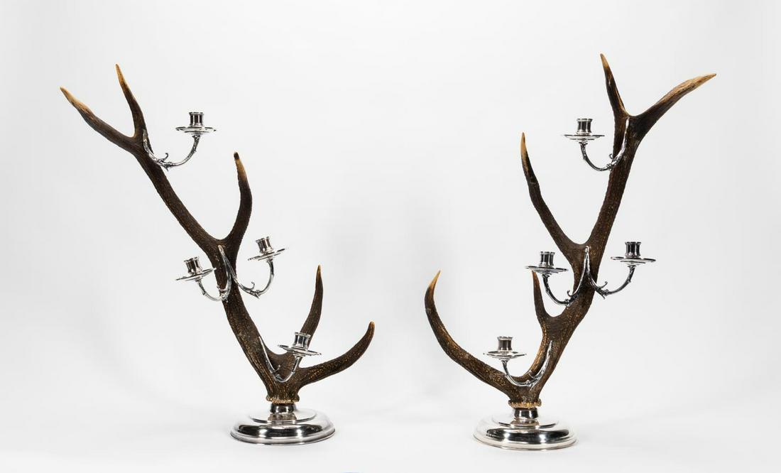 PAIR, SILVERPLATE & ANTLER FOUR LIGHT CANDELABRA: American or English. Pair of silverplate four light mounted antler, possibly elk, candelabra with decorative foliate arms in the style of Anthony Redmile Apparently unmarked. Approx. h. 28.5", w. 19".