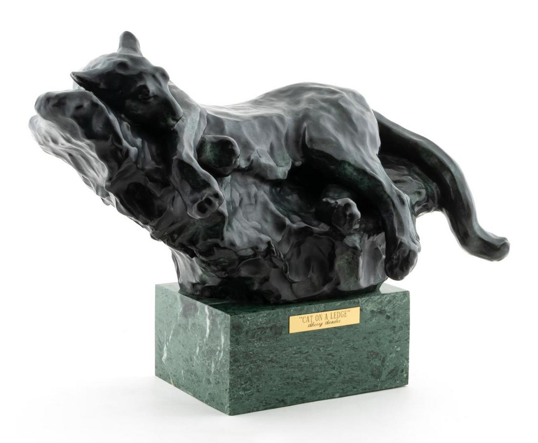 SHERRY SANDER, CAT ON LEDGE, BRONZE: Sherry Salari Sander (American/Montana, b 1941). "Cat on Ledge" -1984, bronze. Signed, dated and numbered 24/25 under tail, on green marble base.Approx. h 11.5" w 15.5" d 6.5"