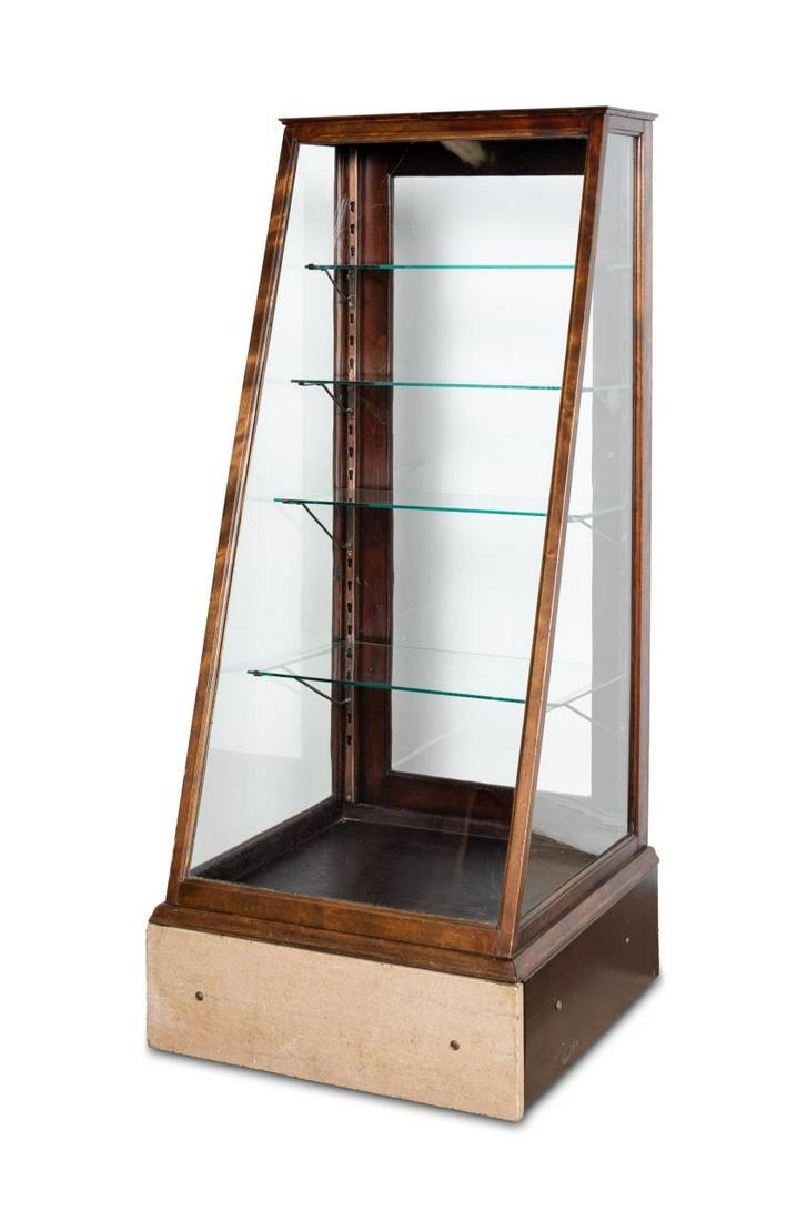 E. 20TH C. SLANT FRONT WOOD AND GLASS DISPLAY CASE: American, early 20th century. Slant front dark wood and glass store display case or cabinet with four graduated glass shelves and marble panels to two sides of the base. Unmarked. Approx. h. 60", w. 2