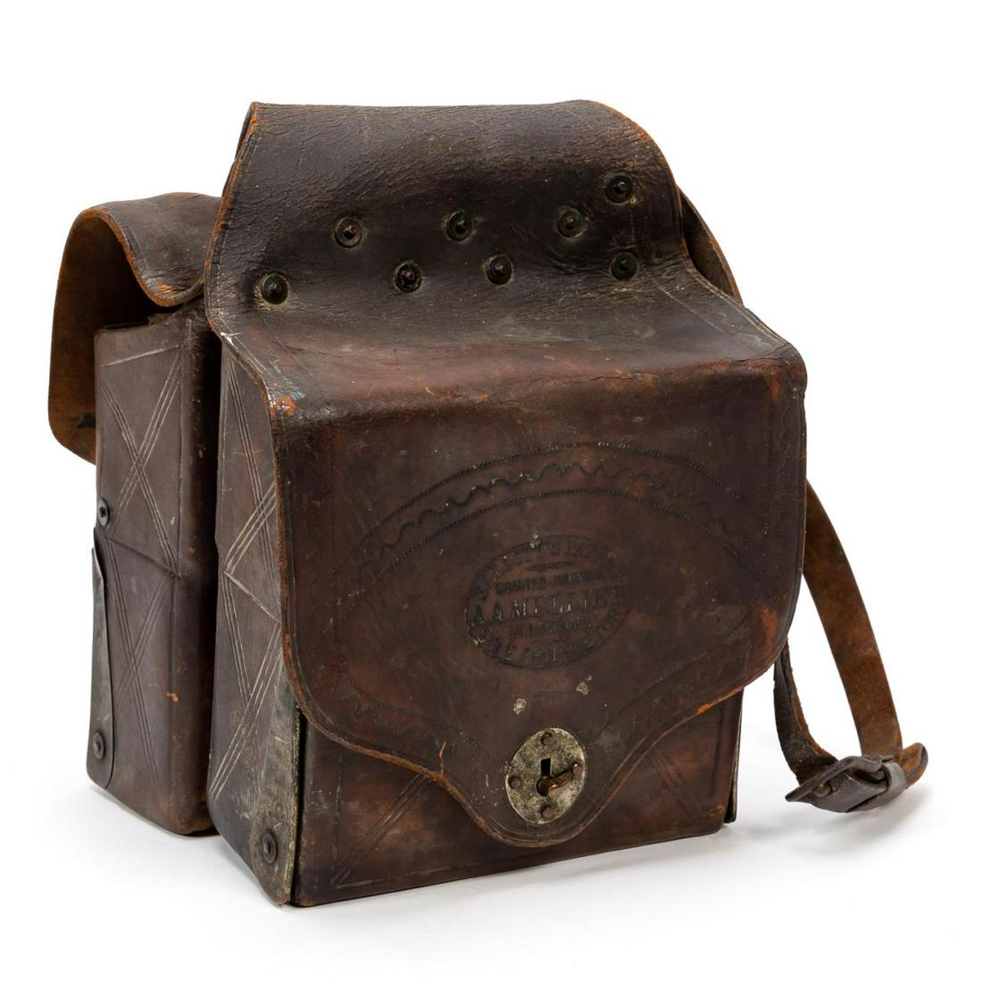 1870'S, ELLIOT'S PATENT MEDICAL SADDLE BAGS, 30PC: Albin A. Mellier (American, 1850 - 1916), 1870. Tooled brown leather medical saddle bags, each containing two tin lined compartments, the lower compartments folding out, three compartments divided and
