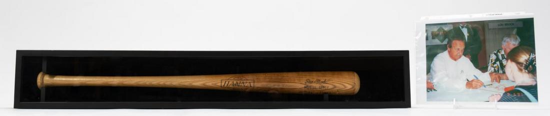 2PCS, CASED STAN MUSIAL SIGNED BAT W/ PHOTO: Hanna Manufacturing Company (American), first half 20th century. Musial Pro style baseball bat autographed by Stan "The Man" Musial (Hall of Fame) of the St. Louis Cardinals (1941-1963) in 1995. Accom