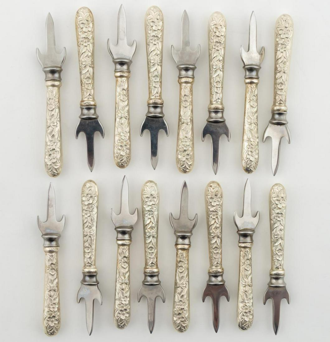16 KIRK "REPOUSSE" CORN COB PICKS: Kirk-Stieff, American, 20th century. 16 "Repousse" pattern sterling silver handle cob corn holders with stainless trident picks. Signed S. Kirk & Son.Approx. l. 3.25"