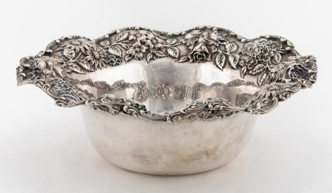 AMERICAN STERLING FLORAL REPOUSSE RIM BOWL: Baltimore Silversmiths Manufacturing Company (American, 1903-1905). Sterling silver bowl with flared repousse floral rim retailed by Hennegen Bates Company, with marks for maker and retailer to unders