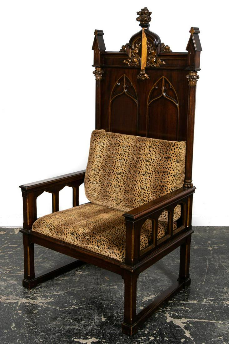 PARTIAL GILT GOTHIC REVIVAL THRONE ARMCHAIR: Likely English, first half 20th century. Oversized mahogany gothic revival armchair or throne in the manner of Augustus Welby Pugin (English, 1812-1852), possibly from a lodge or church, having a foli