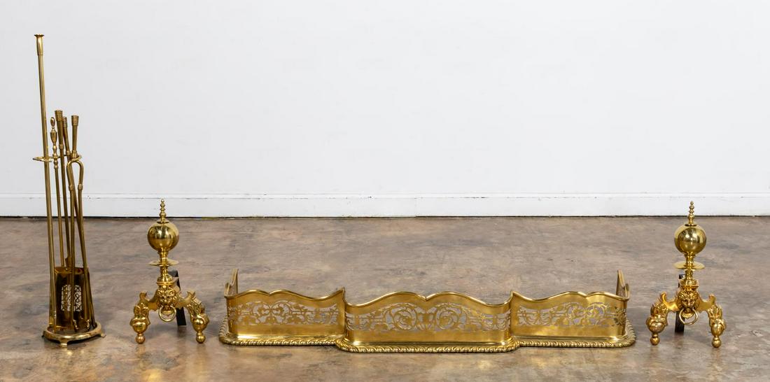 EIGHT PIECE ENGLISH BRASS FIRE ACCESSORIES: English, 20th century. An eight piece grouping of Georgian style brass fireplace accessories including a pierced fire fender, fire tool stand, pierced shovel, tongs, two pokers, and a pair of andirons