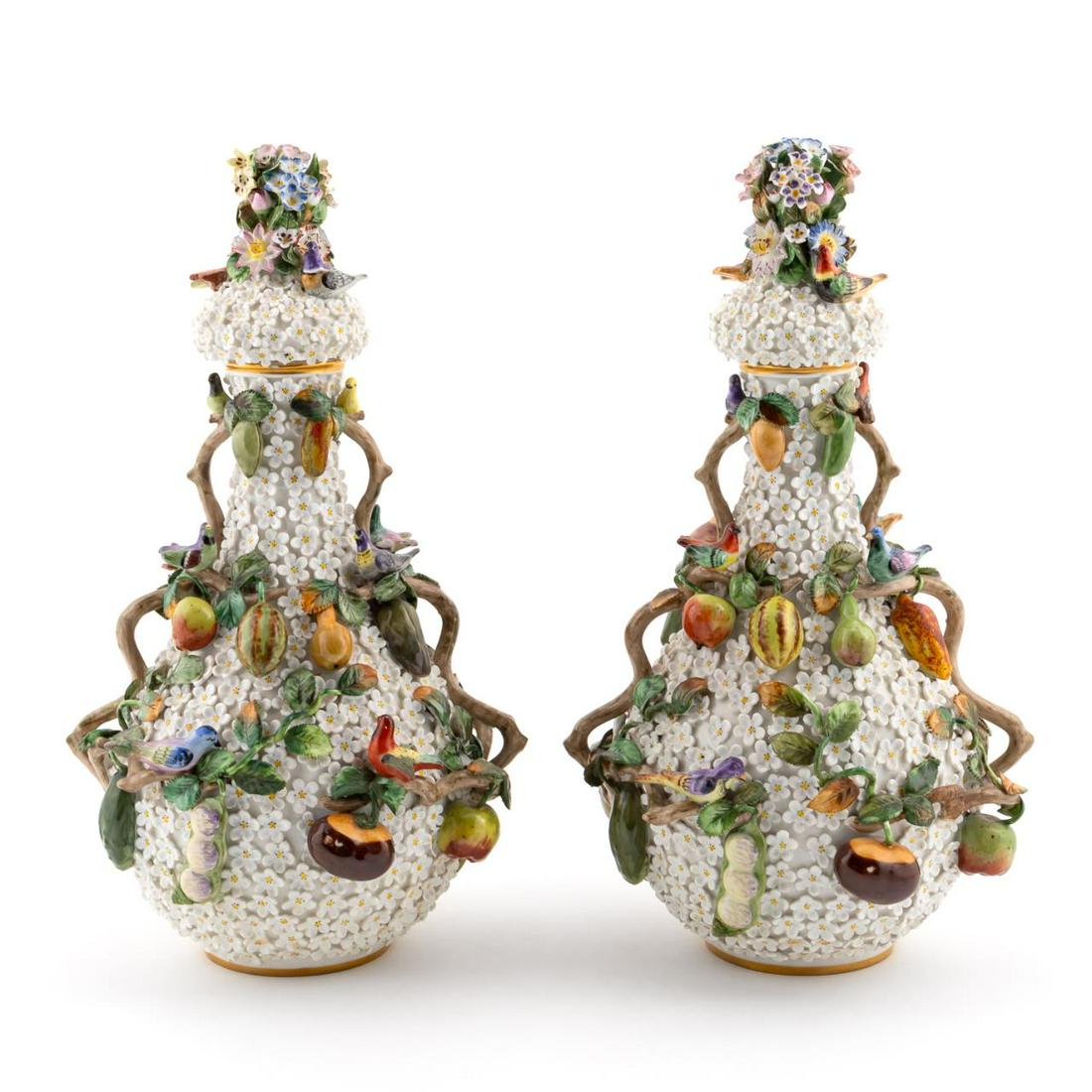 PAIR, EARLY MEISSEN SNOWBALL COVERED URNS: Meissen, late 18th to early 19th century. A magnificent matched pair of snowball porcelain covered urns heavily decorated with birds, fruits, nuts and daisy flowers. Marked with crossed swords mark da