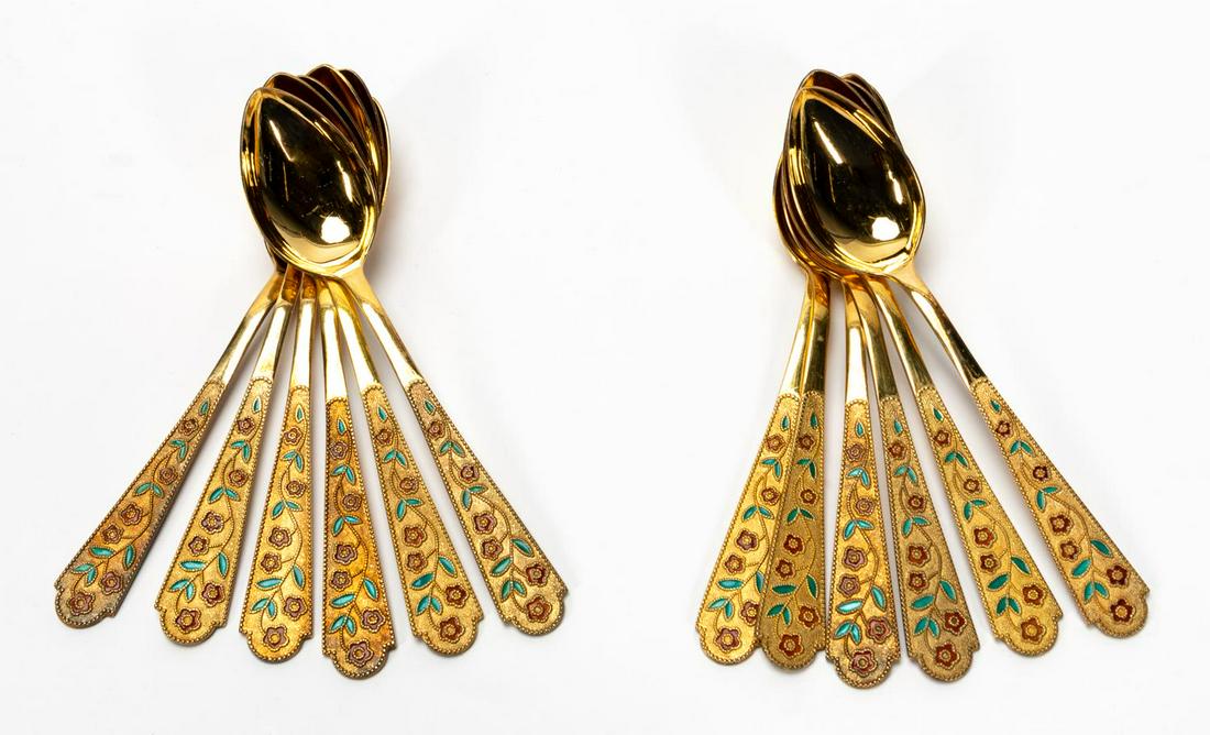 12 SOVIET RUSSIAN VERMIEL & ENAMEL TEASPOONS: Russian, after 1958. Twelve hallmarked gold on .875 silver teaspoons having a stippled panel handle with red & green enameled floral vine design with a beaded border, the bowls highly polished, the ba