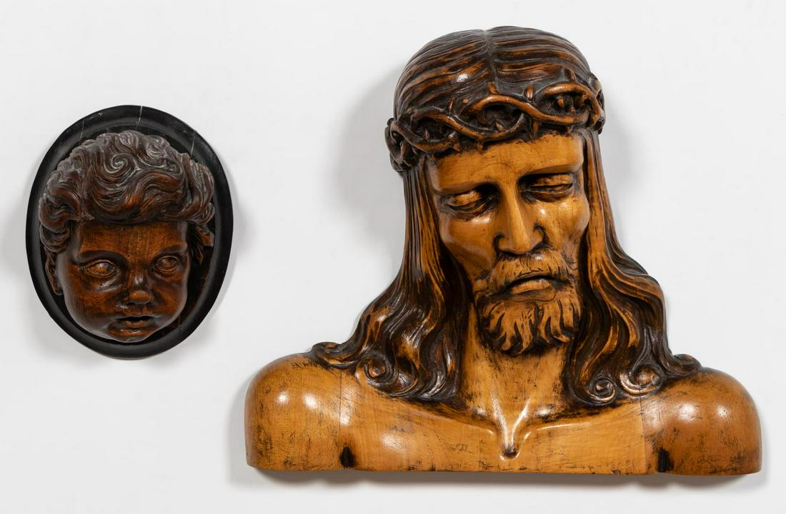 TWO CONTINENTAL RELIGOUS CARVINGS, WALL MOUNTED: Continental school, early 20th century. "Christ" and "Cherub", carved wooden figures. Unsigned, cherub head mounted to a wood plaque.Approx. h 13.75" w 16.25" d 6" (Christ), h 8" w 6.5" d 4.75" (head)