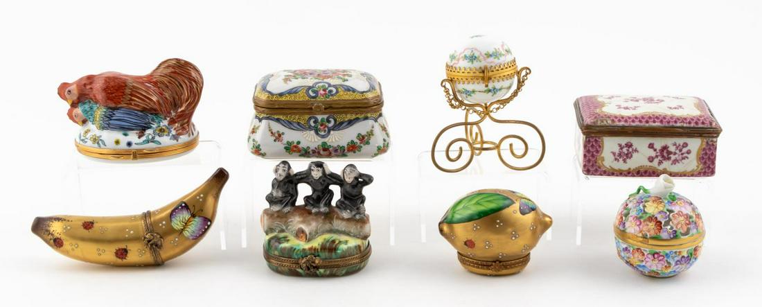 EIGHT WHIMSICAL PAINTED PORCELAIN BOXES: Continental, 20th century. Group of eight small whimsical painted porcelain trinket boxes comprising of motifs including fruit, animals and floral designs. Three marked Limoges, one Samson, one Herend