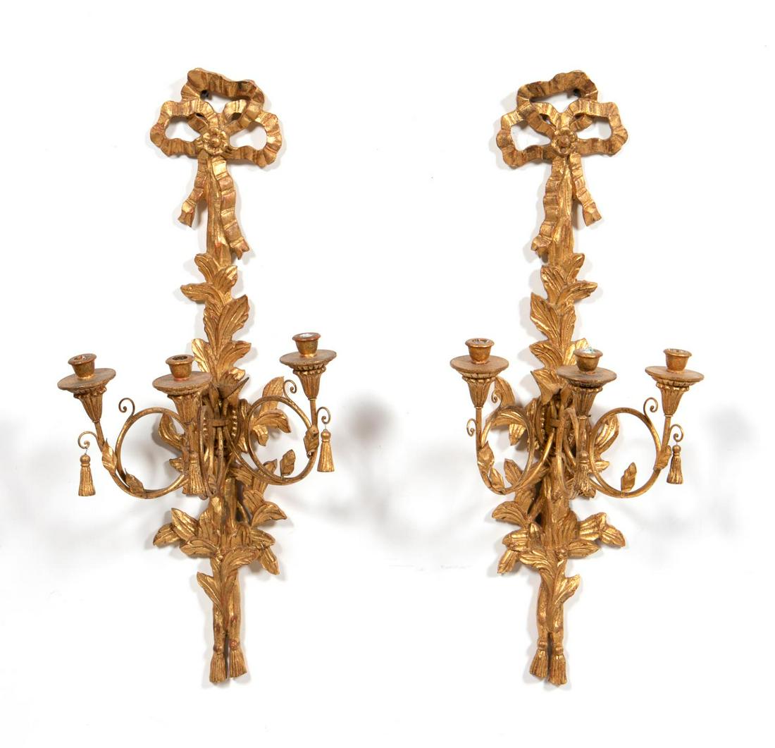 PAIR, CONTINENTAL GILTWOOD 3 LIGHT CANDLE SCONCES: Continental, likely Italian. Pair of giltwood candle sconces having three lights and topped with a bow form. Apparently unmarked.Approx. h. 36". w. 15.5".