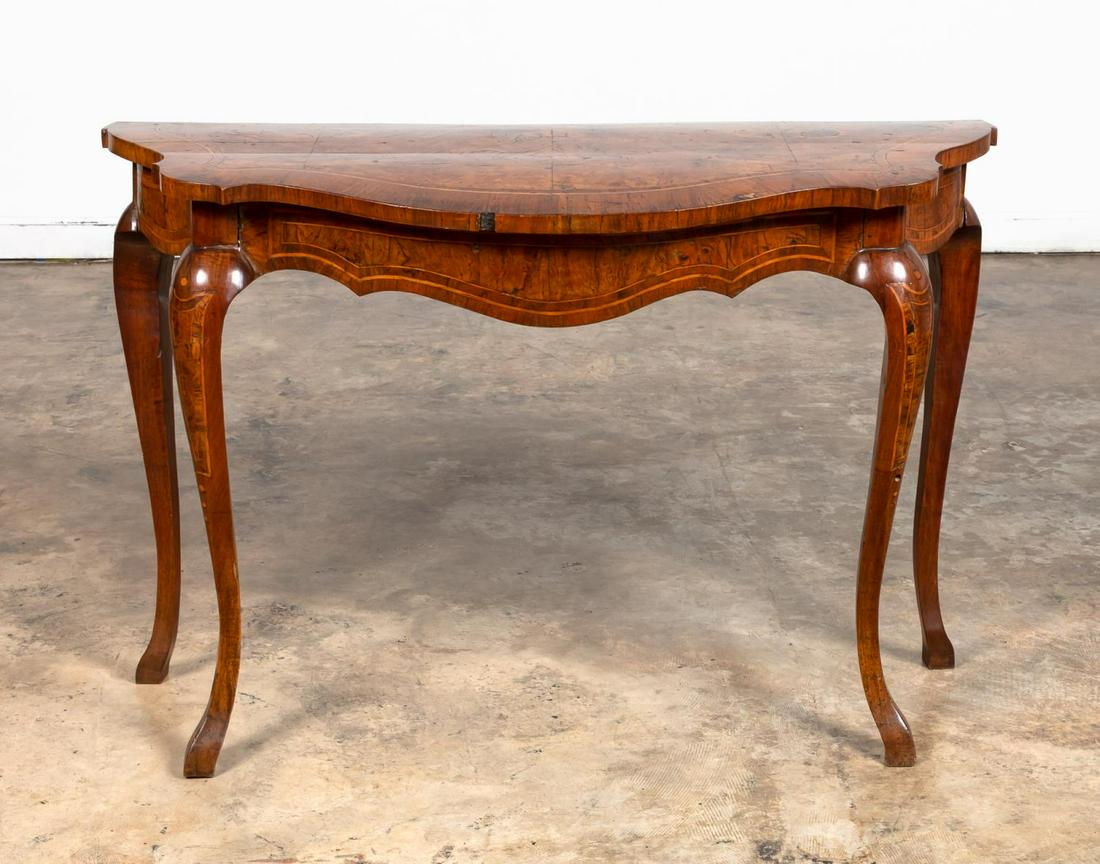 19TH C. ITALIAN BAROQUE BURL WALNUT CONSOLE TABLE: Italian, 19th century. Italian Baroque style walnut console table having a shaped top featuring burled walnut crossbanded with rosewood, the frieze conforming in shape and inlay, supported on four cab