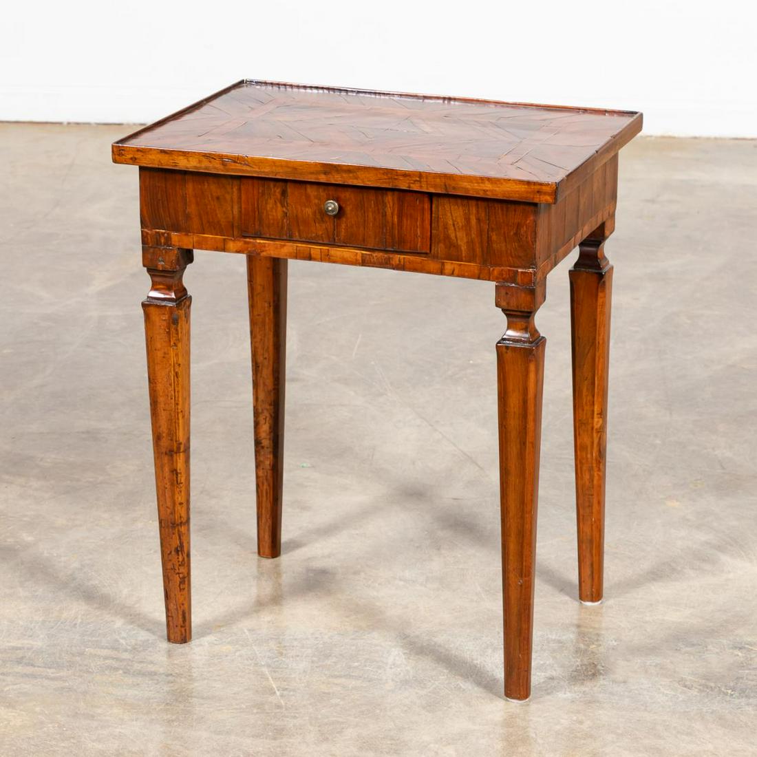 LATE 19TH CENTURY ITALIAN ONE DRAWER STAND: Italian, late 19th century. One drawer stand/work table with rosewood veneered and banded top, veneered frieze with single drawer having a divided interior, on 4 walnut square tapered legs.Approx. h. 
