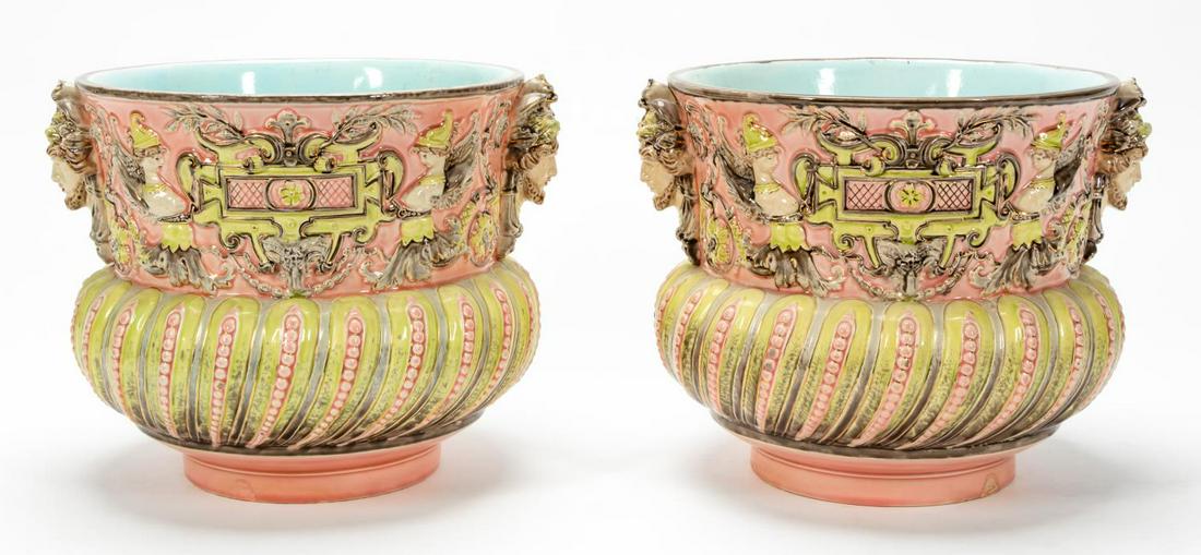 PAIR CONTINENTAL MAJOLICA ROCOCO STYLE JARDINIERES: Continental, likely Italian, late 19th / early 20th century. Pair of Rococo style planters with grotesques, winged mythical creatures, robin's egg blue interior and gilt accents. Apparently unmarked.A