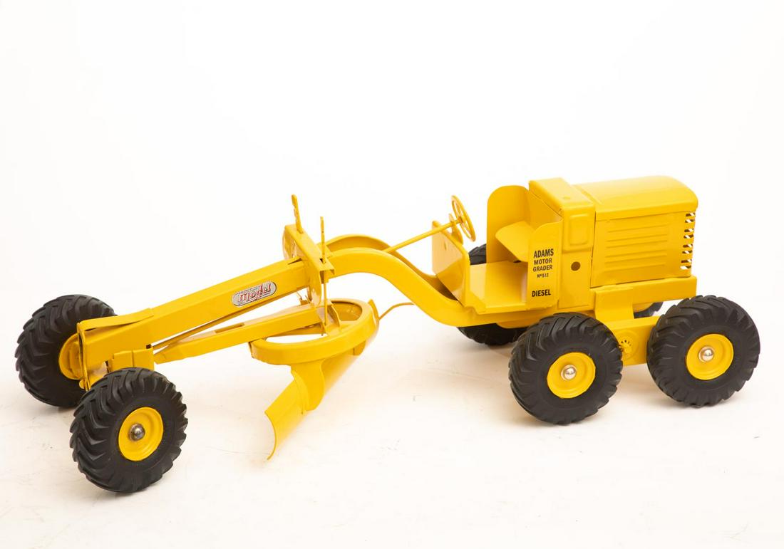 Yellow Earth Mover Truck by Doepke: Diecast model toy truck. Approx. 26"L Please note: This lot is not housed at Ahlers & Ogletree Auction Gallery. Pickup address will be supplied to winning bidder. All purchased lots MUST be picked up 
