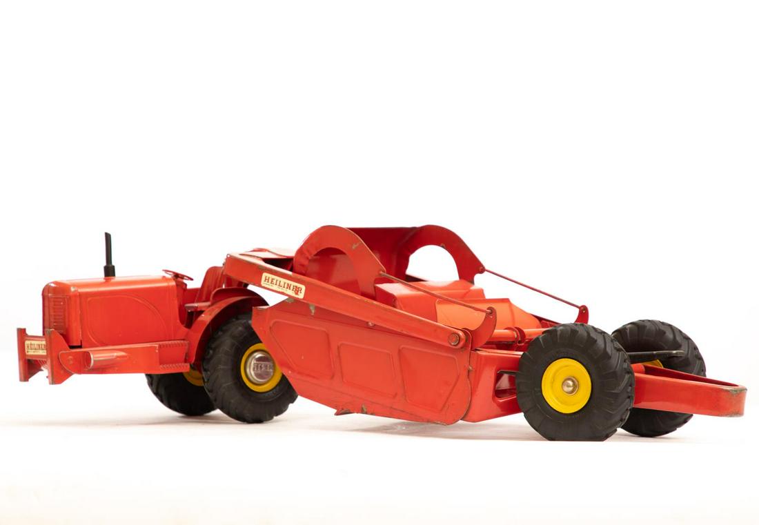 Red Model Earth Mover Truck by Doepke: Diecast model toy truck. Approx. 26"L. Please note: This lot is not housed at Ahlers & Ogletree Auction Gallery. Pickup address will be supplied to winning bidder. All purchased lots MUST be picked up