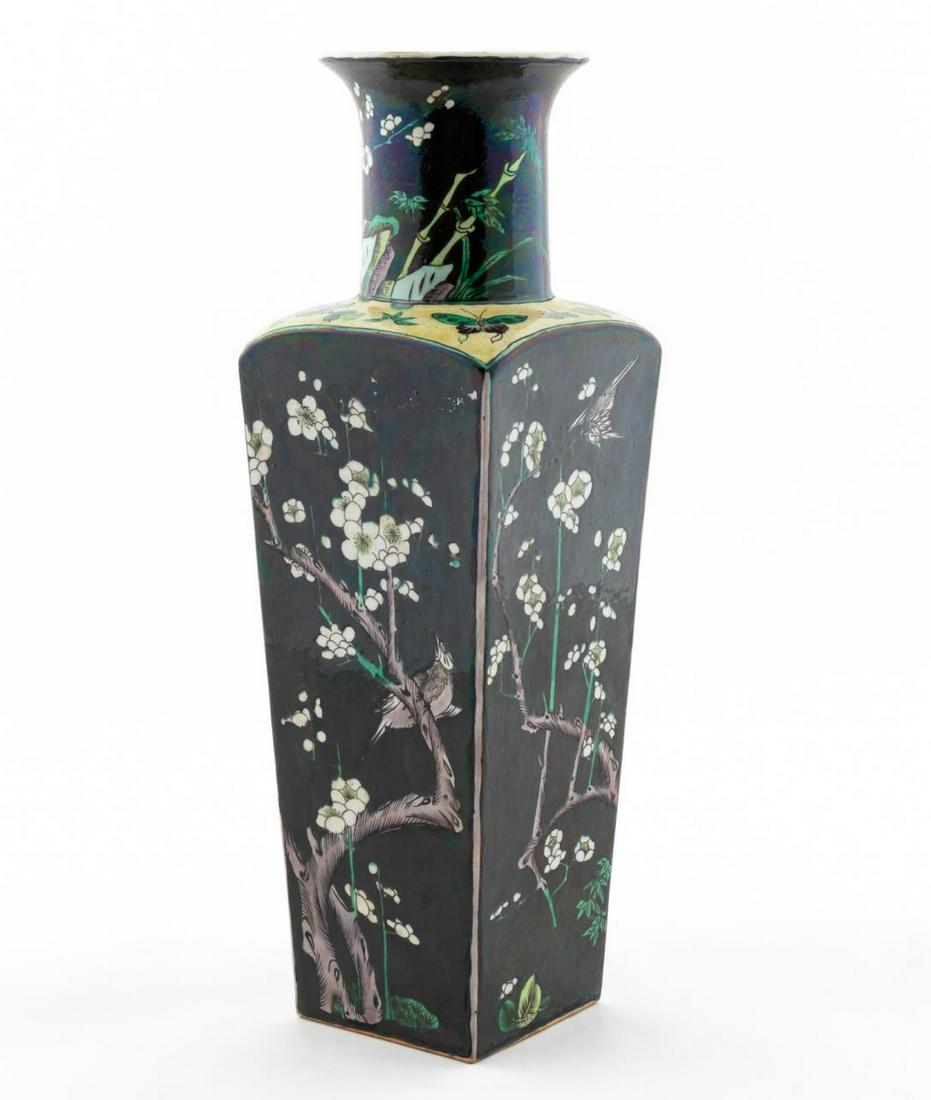 CHINESE FAMILLE NOIR SQUARE VASE, WHITE FLOWERS: Chinese. Famille noir square form porcelain vase with floral and bird motif. Apparently unmarked. Approx. h. 13.75".