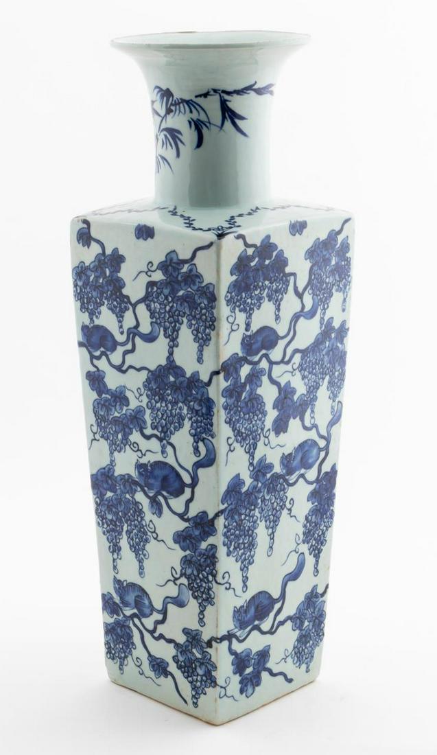 CHINESE BLUE & WHITE GRAPEVINE MOTIF VASE: Chinese. Blue and white square form vase with grape vine and animal decoration. Mark to underside, six character blue mark, likely K'ang Hsi. Approx. h. 20", w. 6".