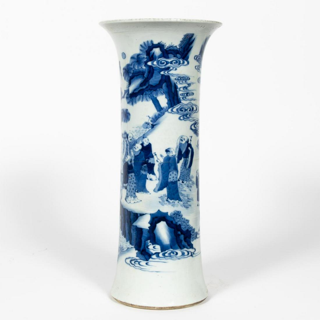CHINESE BLUE & WHITE PORCELAIN GU VASE: Chinese. Porcelain Gu /beaker vase with blue and white decoration of immortals in a landscape among the clouds, incised cloud rim and base borders. Apparently unmarked. Approx. h. 18.625, dia. 8.125"