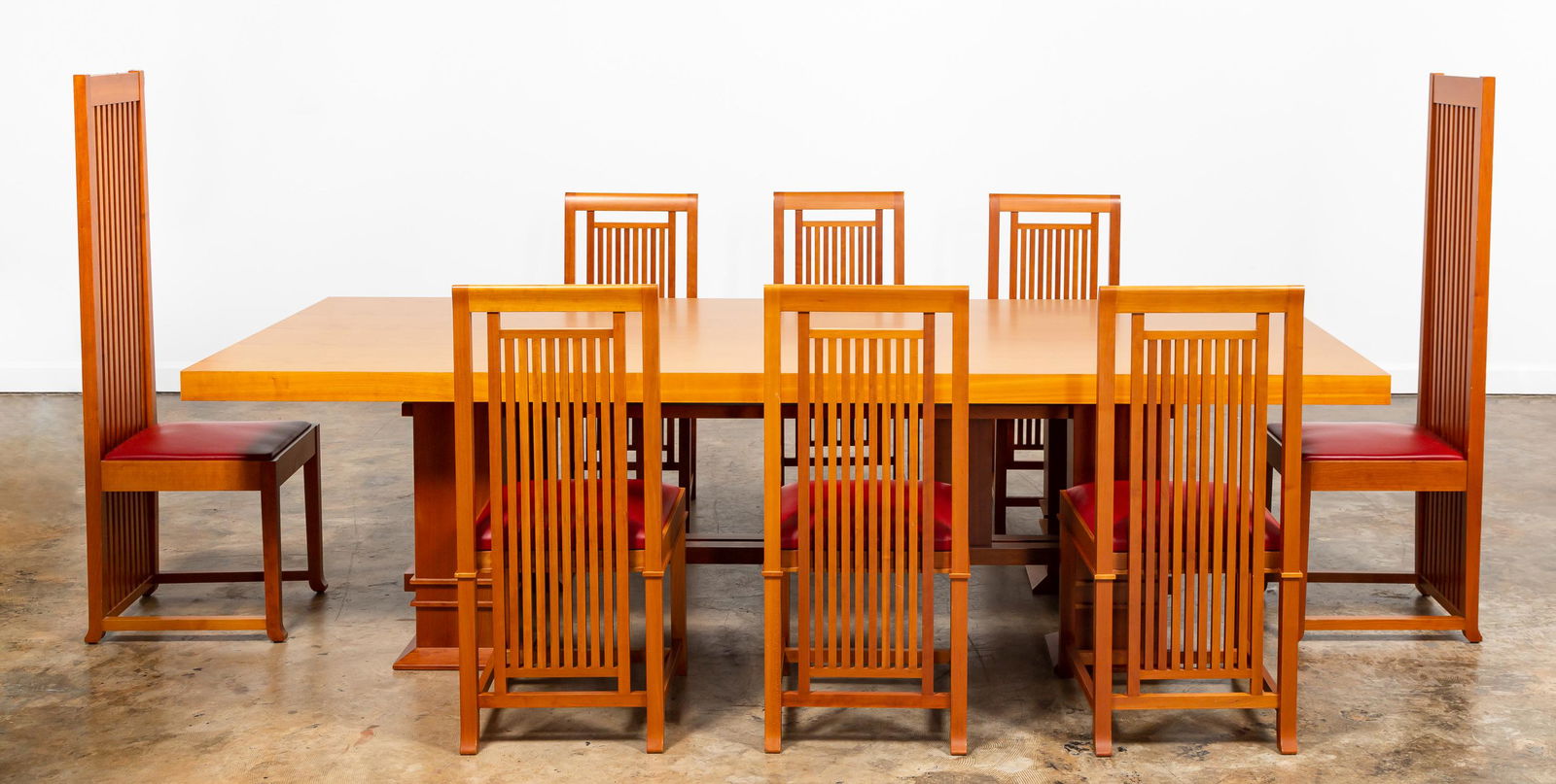 FRANK LLOYD WRIGHT / CASSINA DINING TABLE & CHAIRS: Cassina (Italian) for Frank Lloyd Wright Foundation, circa 1992. Nine piece dining set, likely in cherry wood, including "Allen" (905) rectangular dining table, two tall back "Robie 1" (601) chairs an