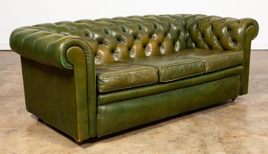 GREEN LEATHER CHESTERFIELD THREE-SEATER SOFA: Likely English, 20th century. Green leather Chesterfield sofa having a tufted rolled back and arms, with three loose seat cushions, and on casters. Unmarked. Approx. h. 26.5", w. 70", d. 32".